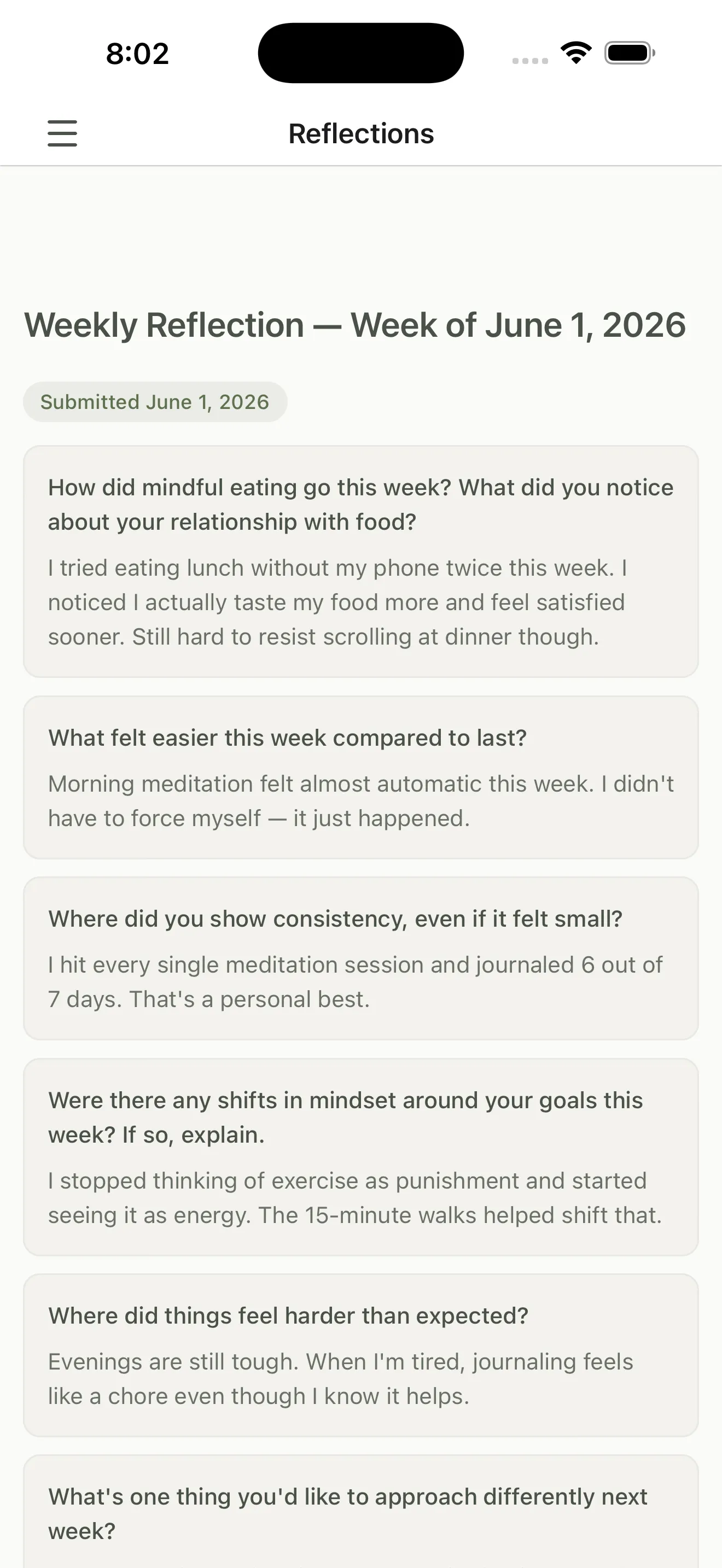 A submitted weekly reflection showing the client's written answers about mindful eating, what felt easier, and where things got harder.
